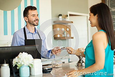 Paying at a cash register Stock Photo