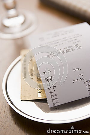 Paying Restaurant Bill With A Credit Card Stock Photo