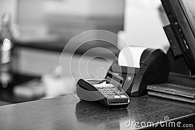 Payment with credit card. Red bankcard inserted in EDC machine Stock Photo
