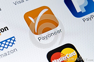 Payoneer application icon on Apple iPhone X smartphone screen close-up. Payoneer app icon. Payoneer is an online electronic paymen Editorial Stock Photo