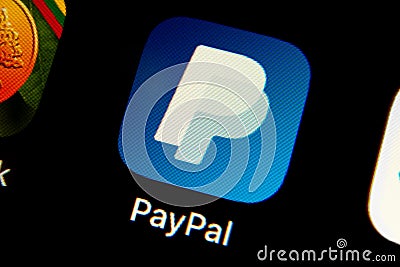 PayPal app logo on iPhone screen. Cellphone with an icon of a biggest online payment company on a market. Editorial Stock Photo