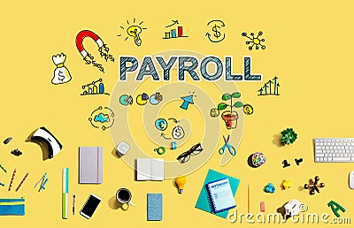 Payroll with electronic gadgets and office supplies Stock Photo