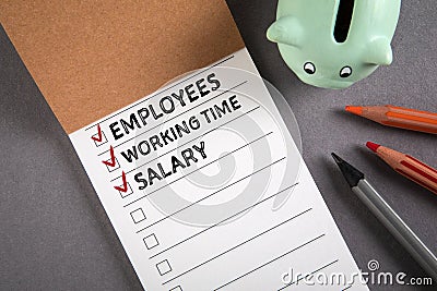 Payroll concept. Salary, employees and working time. Notebook on gray office desk Stock Photo