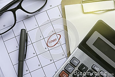 Payroll and payday concept with calculator and calendar Stock Photo