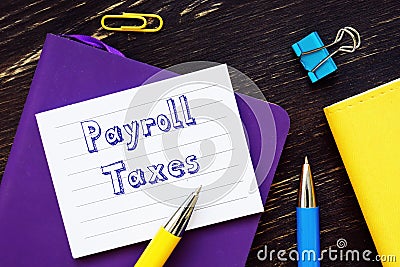 Payroll Taxes inscription on the piece of paper Stock Photo