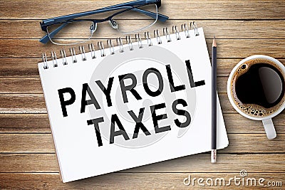 PAYROLL TAXES,Text on notebook in office desk workplace background Stock Photo