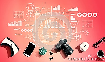Payroll theme with electronic gadgets and office supplies Stock Photo