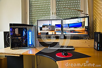 PC Personal computer with 2 flat screens, modding and picture of Editorial Stock Photo