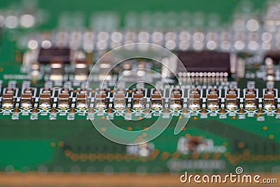PCB with SMD capacitors close-up. Macro photography of a fragment of the decoder panel tft LCD monitor Stock Photo