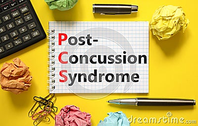 PCS post-concussion syndrome symbol. Concept words PCS post-concussion syndrome on white note on a beautiful yellow background. Stock Photo
