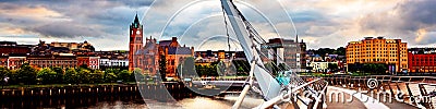 Peace bridge in Derry Londonderry in Northern Ireland, UK with city center at the background Editorial Stock Photo