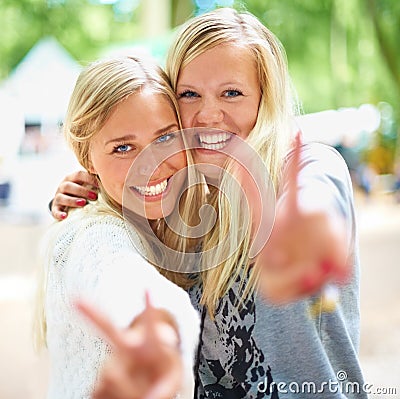 Peace hands, portrait and women friends hug in a park with freedom, fun and bonding in nature together. V sign, face and Stock Photo