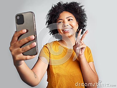 Peace sign, selfie and smile with woman in studio for social media, connection and profile picture. Happy, emoji and Stock Photo