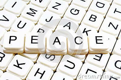 Peace text word crossword title caption label cover background. Alphabet letter toy blocks. White alphabetical letters. Stock Photo