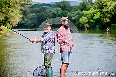 Peaceful activity. Nice catch. Rod and tackle. Fisherman fishing equipment. Fisherman grandpa and mature man friends Stock Photo