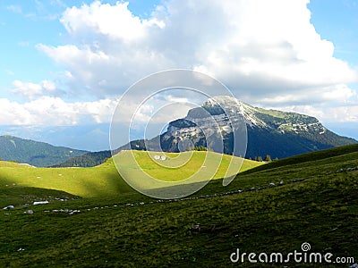 Peaceful landscape, fields and a mountain peak in Charmant Som, France Stock Photo