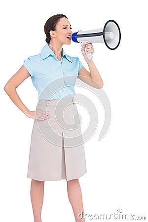 Peaceful classy businesswoman talking in megaphone Stock Photo