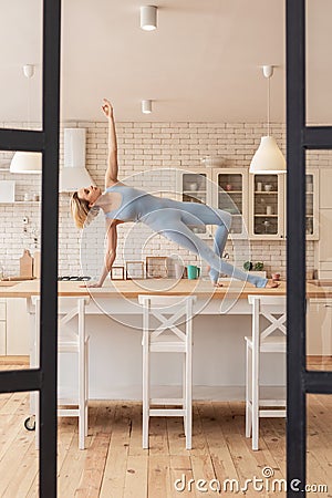 Peaceful good-looking skinny girl being involved in unusual performance Stock Photo