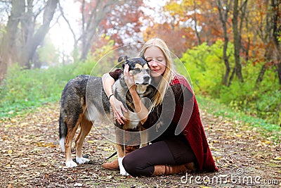 Peaceful Happy Woman Hugging German Shepherd Dog While Walking i Stock Photo