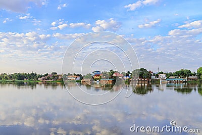 Peaceful Kamphaeng Phet town waterfront on Ping River with reflection Stock Photo