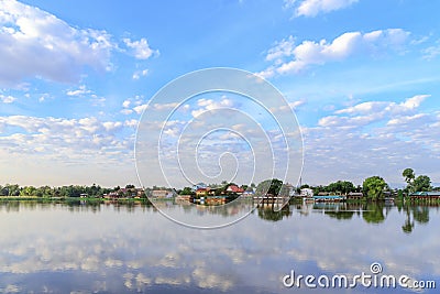 Peaceful Kamphaeng Phet town waterfront on Ping River with reflection Stock Photo