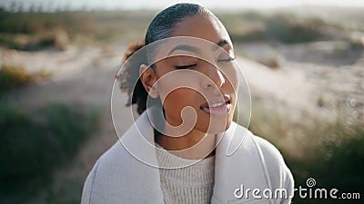 Peaceful model open eyes meditating outdoors closeup. Beautiful african american Stock Photo