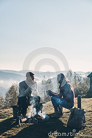 Peaceful morning. Beautiful young couple having morning coffee w Stock Photo