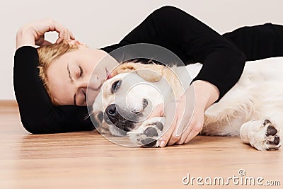 Peaceful Nap, Young woman and her dog Stock Photo