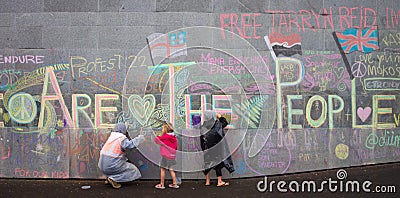 Peaceful Protestors decorate the wall of the Beehive Editorial Stock Photo