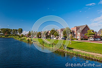 Peaceful quiet suburban with expensive houses on lake in Europe Stock Photo