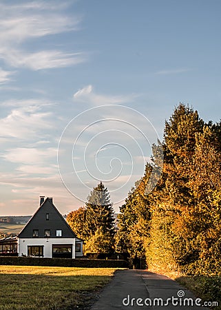 Peaceful rural cottage in autumn scenery Stock Photo