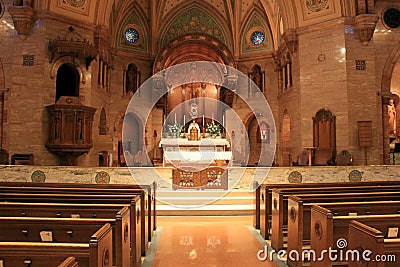 Peaceful scene with empty pews in front of alter, Holy Ghost Catholic Church,downtown Denver,2015 Editorial Stock Photo