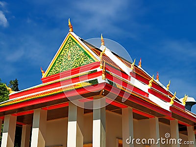Peaceful Thai temple soaring into blue sky Stock Photo