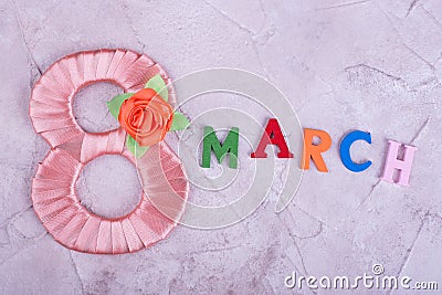 Peach figure eight and word March Stock Photo