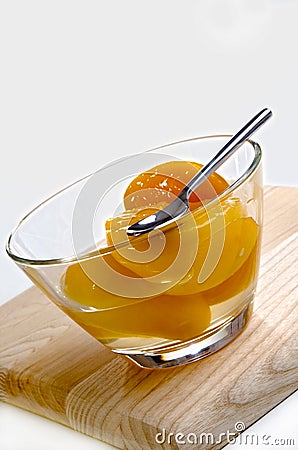 Peach half in a glass bowl Stock Photo