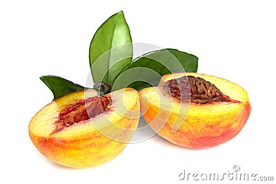 Peach sliced into two halves with leaf on white background isolated close up Stock Photo