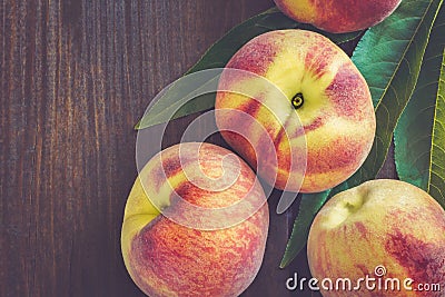 Peaches on dark wooden background Stock Photo