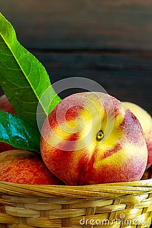 Peaches in weaved basket Stock Photo