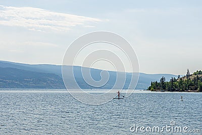 PEACHLAND, CANADA - AUGUST 01, 2020: beautiful summer day paddle-boarding at okanagan lake Editorial Stock Photo