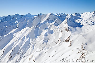 The peaks of the mountain range in winter Alps Stock Photo