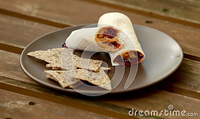 Peanut butter and jelly wrap with chips Stock Photo