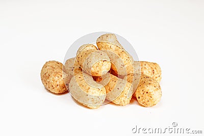 Peanut flips isolated on white background. Pile of snack food close-up Stock Photo