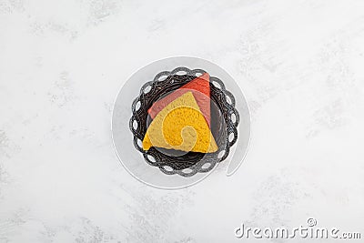 Peanut Halva with the taste of melon and pomegranate on metal saucer. Oriental sweets, top view, copy space Stock Photo