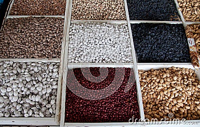 Peanuts, salted pistachios, bodom, raisins and prunes are sold at the Chorsu bazaar in Tashkent Stock Photo