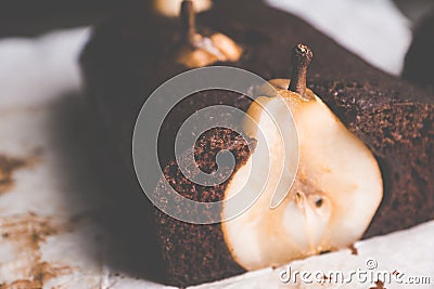 Pear chocolate cake on the rustic background Stock Photo