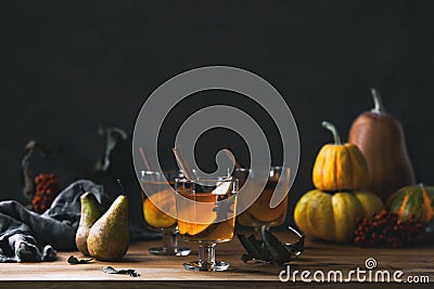 Pear cider in glasses standing on wooden rustic table front view Stock Photo