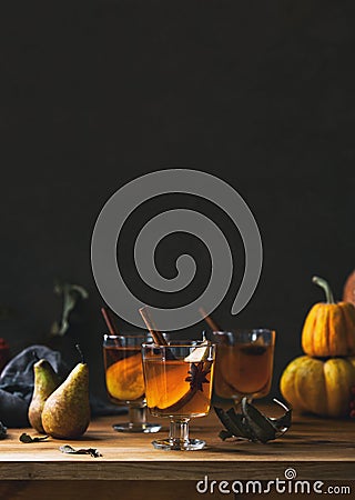 Pear cider in glasses standing on wooden rustic table front view Stock Photo