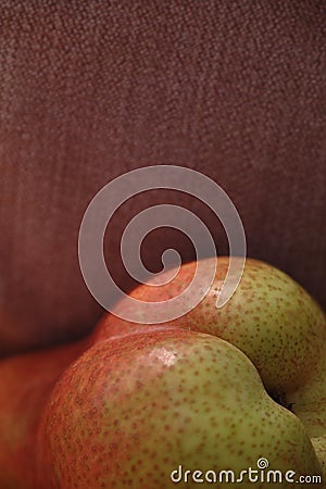 Pear still life against beige cloth background Stock Photo