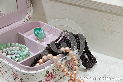 Pearl and garnet necklace in a pink box Stock Photo