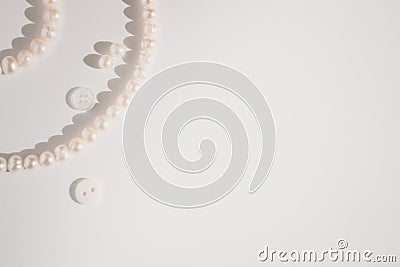 Pearl jewelry on paper with copy space Stock Photo